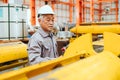 Professional senior worker, High skill expert Japanese machine operator work in industry factory Royalty Free Stock Photo