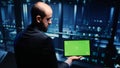 Professional server engineer using greenscreen on tablet