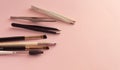 Professional set for styling eyebrows on a pink pastel background with place for text. Flat invoice composition. Makeup set