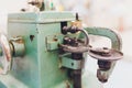 Professional sewing machine on the background of atelier studio. Workplace of tailor - sewing machine, rolls of thread Royalty Free Stock Photo