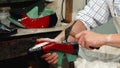 Professional shoemaker making new shoes at his workshop