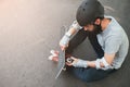 Professional skater checks his skateboard