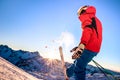 Professional skier at sunset on relax moment in french alps ski resort - Winter sport concept with adventure guy on mountain top Royalty Free Stock Photo