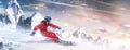 Professional skiing in action. Heli skiing. Motion of the skiing downhill in the mountains. Sportsman in a red ski suit