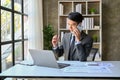 Professional Asian businessman is on the phone with his client, counseling business over the call Royalty Free Stock Photo