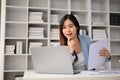 Smart Asian businesswoman preparing reports and working on her business project on her laptop Royalty Free Stock Photo