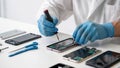 Professional Smartphone Repair Technician Fixing Mobile Device Internals Royalty Free Stock Photo