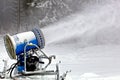 Professional snow cannon making snowflakes Royalty Free Stock Photo