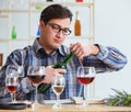 Professional sommelier tasting red wine