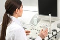 Professional sonographer using modern ultrasound machine