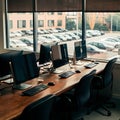 Professional, spacious office setup with three monitors, keyboards, mice, and large windows. Royalty Free Stock Photo