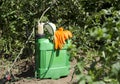 Professional spray pump and other tools in the garden. Seasonal spraying tomatoe plants, trees on the farm