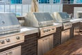 Professional stainless steel barbecue grills with metal hoods