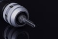 professional reamer drill in collet tool holder. cutting edge right hand. Material Carbide and steel. on dark background.