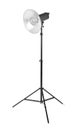 Professional studio flash light isolated on a white background. Studio lighting on a tripod. Photographic equipment.