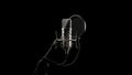 Professional studio microphone with pop filter and stand on black background Royalty Free Stock Photo