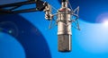 Professional studio microphone with a shock mount, ready for recording highquality audio in a music or podcast setting Royalty Free Stock Photo