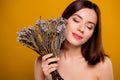 Professional studio portrait young girl touch her cheek exotic bunch dry reed flowers eyes closed enjoy fluffy bloom Royalty Free Stock Photo