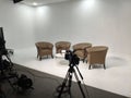 Professional Studio Setup with Armchairs and Camera Royalty Free Stock Photo