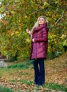Professional stylist advice. Girl fashionable blonde walk in autumn park. Woman wear warm jacket. Jackets everyone