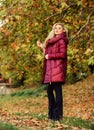 Professional stylist advice. Girl fashionable blonde walk in autumn park. Woman wear warm jacket. Jackets everyone