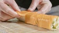 Professional sushi chef preparing roll at commercial kitchen, close-up. Royalty Free Stock Photo