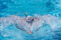 A professional swimmer in the action close up. Breaststroke style.