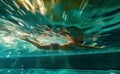 professional swimmer athlete in in pool with blue splashing water at sport competition, man swimming Royalty Free Stock Photo