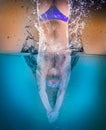 Professional swimmer underwater after the jump Royalty Free Stock Photo