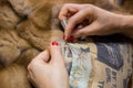 Tailor repairing fur coat Royalty Free Stock Photo