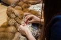 Tailor repairing fur coat Royalty Free Stock Photo