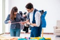 The professional tailor taking measurements for formal suit