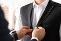 Professional tailor working with client in atelier, closeup Royalty Free Stock Photo