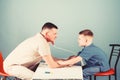 Professional talk. medicine and health. small boy with dad play. Future career. nurse laboratory assistant. family Royalty Free Stock Photo