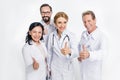 professional team of doctors showing thumbs up and smiling at camera