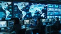 Professional team monitoring global network in a control room Royalty Free Stock Photo