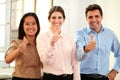 Professional team smiling at you with ok thumb Royalty Free Stock Photo