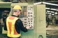Professional technician engineer male operate control heavy industry machine CNC in factory