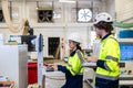 Professional technician engineer team staff worker control operate wood CNC machine together