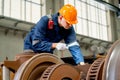 Professional technician or engineer worker hold light stick to check and fix the problem of part of electric train in factory or Royalty Free Stock Photo