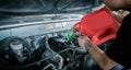 Professional Technician mechanic worker service center for fixing repairs change engine oil