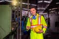 Professional technicians removing hats and masks after working in industrial plants