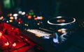 Professional techno rave minimal urban light concert dj turntables player PIONEER device with sound mixer panel and jog wheel.Club Royalty Free Stock Photo