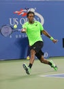 Professional tennis player Gael Monfis during quarterfinal match against seventeen times Grand Slam champion Roger Federer Royalty Free Stock Photo