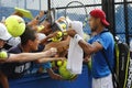 Professional tennis player Jo-Wilfried Tsonga signing autographs after practice for US Open 2014