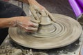 Professional thai old man using mechanic pottery made earthenware for show in traditional culture thai festival at Koh Kret Island