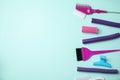 Professional tools for hair dyeing on blue background, flat lay. Space for text Royalty Free Stock Photo