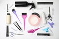 Professional tools for hair dyeing on background, flat lay Royalty Free Stock Photo