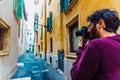 Professional travel photographer captures a shot of a narrow street in an Italian city Royalty Free Stock Photo