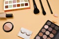 Professional trendy makeup products with cosmetic beauty products, foundation, lipstick,  eye shadows, eye lashes, brushes and Royalty Free Stock Photo